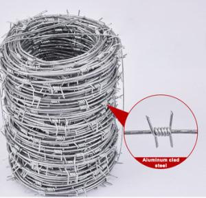 China Spacing 5'' Razor Coil Barbed Wire Security Fence PVC Coated on sale