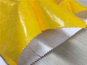 China 0.15mm Dupont Paper Coated Garment Leather Fabric Shining Yellow Color For Fashion Coat on sale
