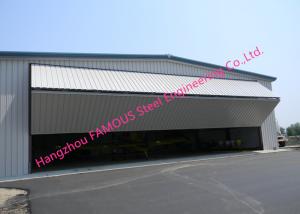 China Dual Panel Hydraulic Hangar Door Upper Folding Industrial Garage Doors With Hard Metal Sandwich Panel on sale