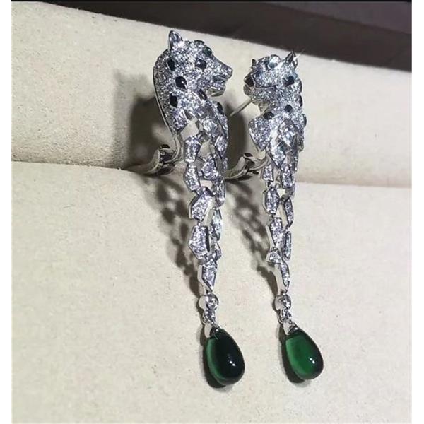 C Cheetah Earrings - showing the charm of courage, naughty or docile .310 round bright cut diamonds, emerald and onyx.