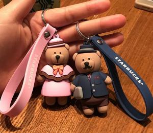 China Hot Sale 3d Brown Bear Doll Soft PVC Keychain Key Holder With Silicone Wristband, Big Production Stock, Best Couple Gift on sale