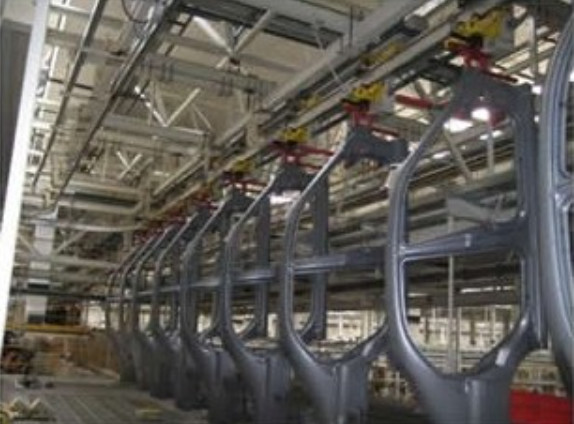 Self-propelled trolley conveyor