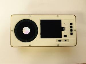 Azan Clock speaker on the table with lArabic anguage