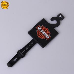China Customized Printed Black Plastic Belt Hangers With Stickers on sale