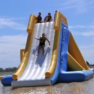 China 0.9mm PVC Tarpaulin Giant Inflatable Floating Water Slide With TUV Certificate on sale